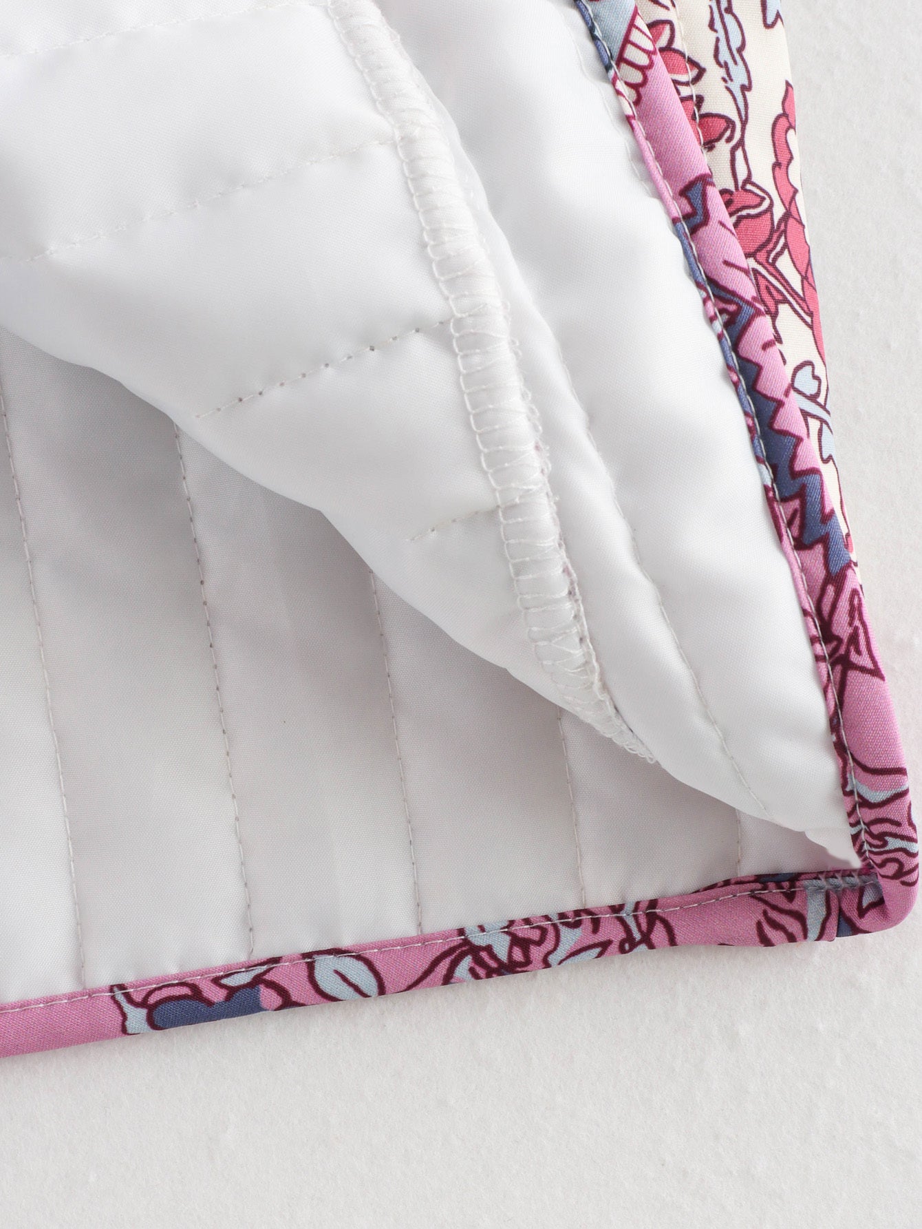 Floral print quilted vest